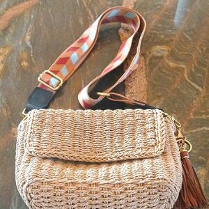 Stylish Woven Crossbody Bag with Vibrant Strap